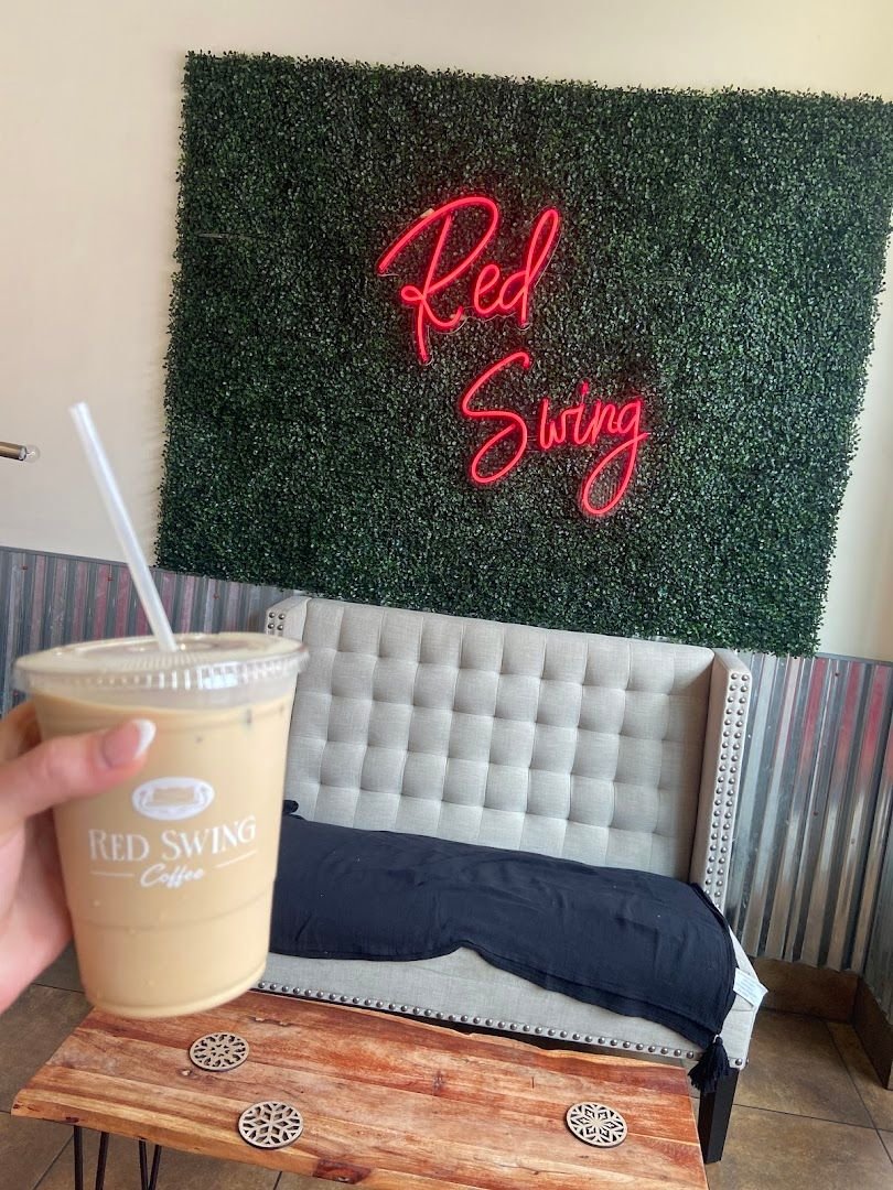 Interior of Red Swing Coffee with its neon Red Swing sign