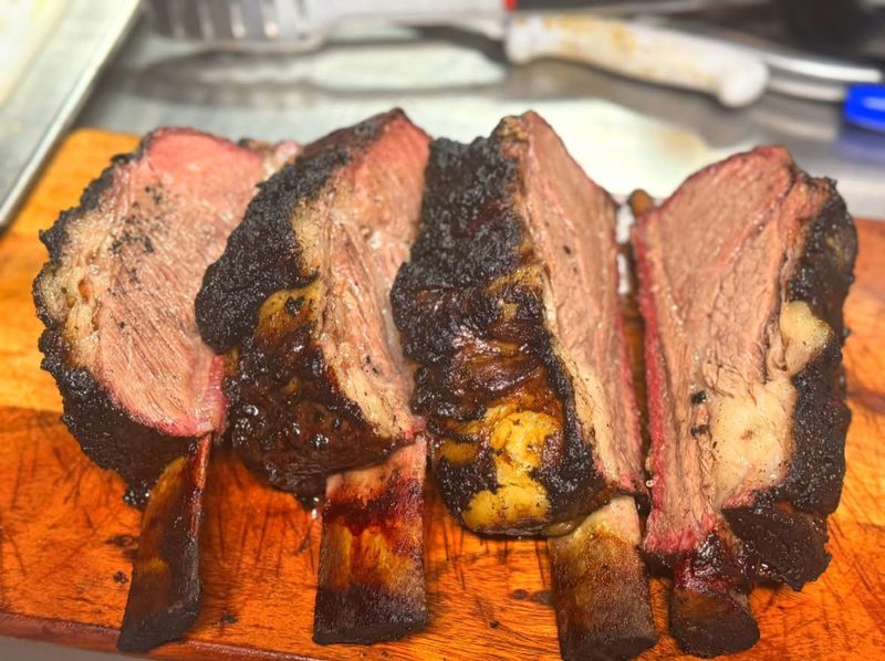 Smoked beef short ribs on a cutting board at Shiloh’s Lounge