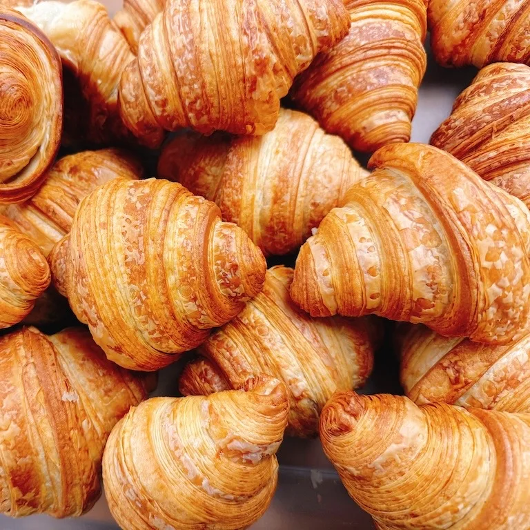 Pile of fresh-baked croissants at Niko’s Bakery & Cafe
